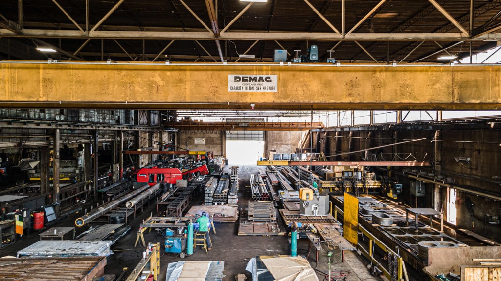 Overhead crane above the steel fabrication floor at Sawing and Shearing in Blue Island, IL